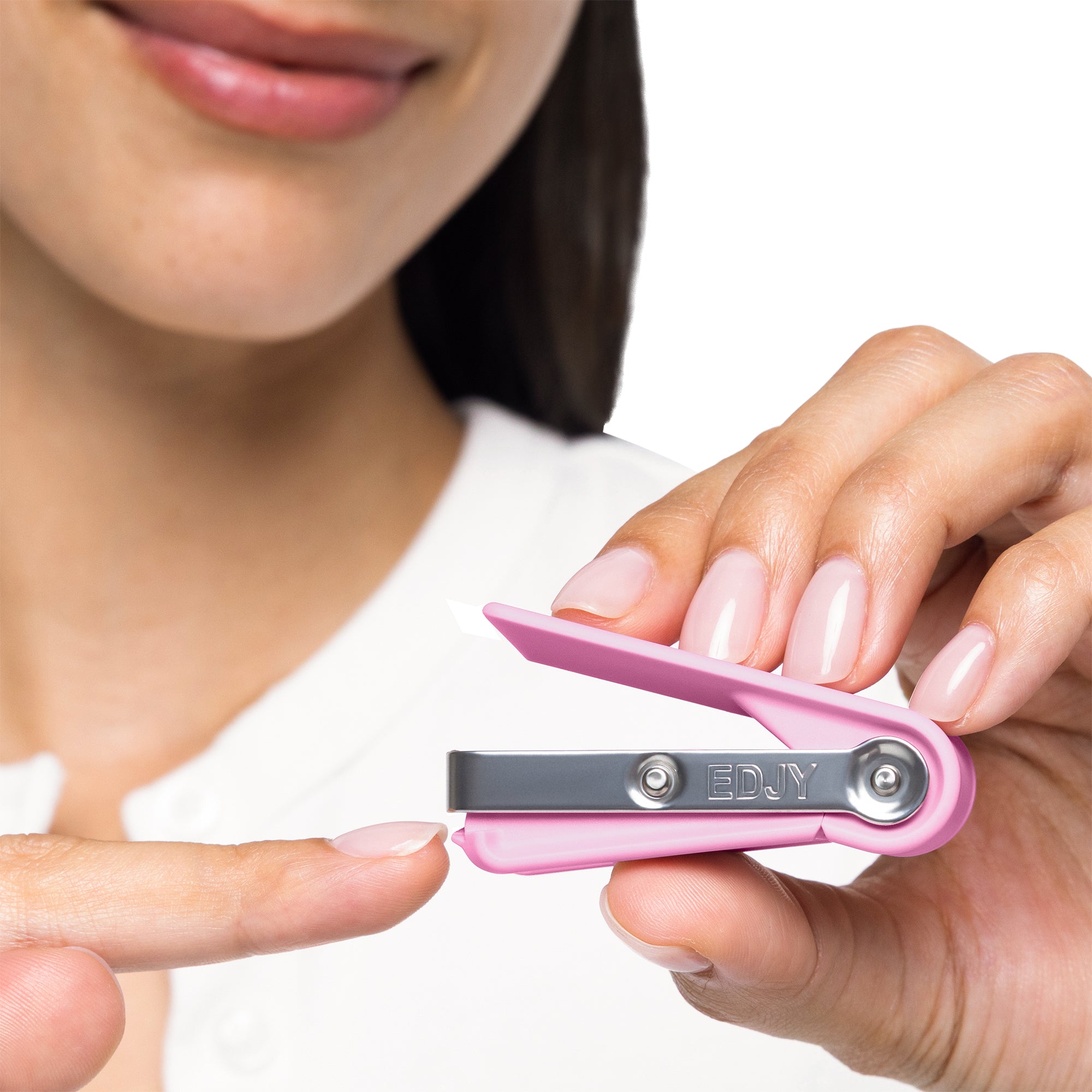 Woman cutting her fingernail with and EDJY fingernail cutter